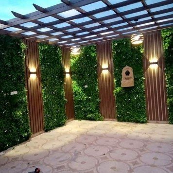 تنسيق حدائق بالمدينة المنورة تركيب عشب صناعي وتصميم شلالات ونوافير وتكريب نخيل وقص اشجار
